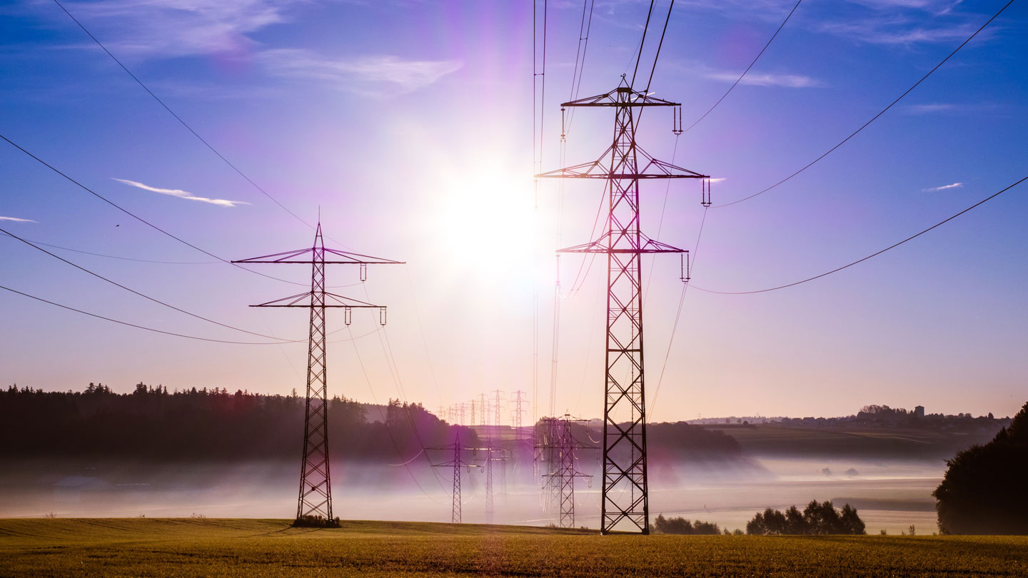 power grid poles in a field